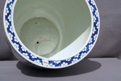 A Chinese blue and white fish bowl and a famille rose 'dragon' jardini&egrave;re, 19th C. and Yongzheng